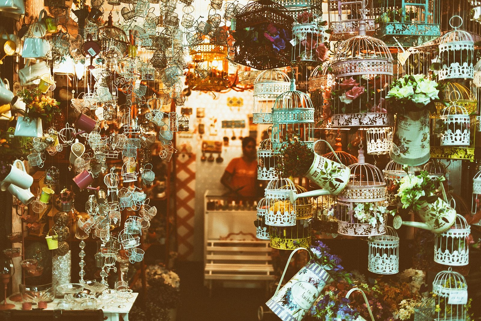 selective focus photo of pet cages with flowers